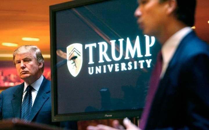 Donald Trump listens as he is introduced at a news conference in New York where he announced the establishment of Trump University. Trump is scheduled to go on trial this month in a class-action lawsuit against him and his now-defunct Trump University, potentially taking the witness stand weeks before his inauguration as president of the United States. 
