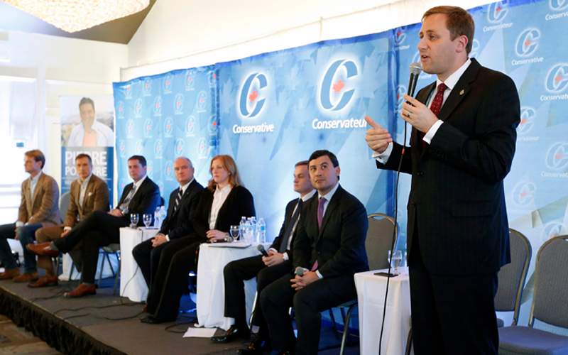Conservative leadership candidate Brad Trost, right, responds to questions from the audience at a Conservative leadership debate in Greely, Ont., on Sunday, November 13, 2016. 