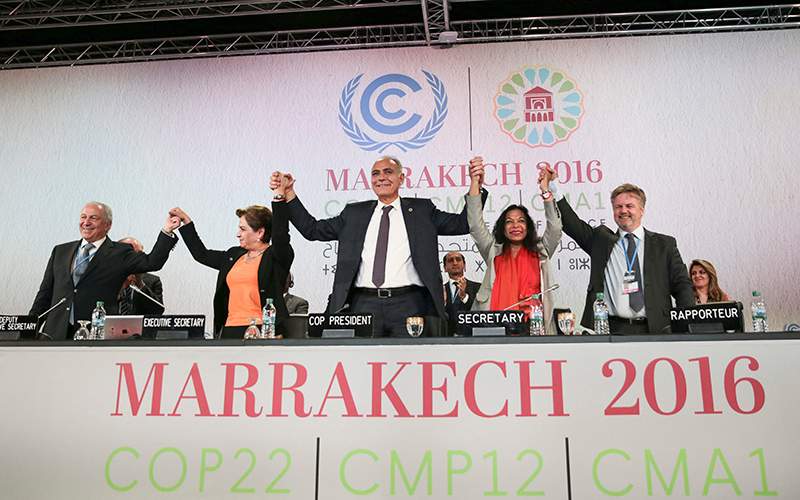 U.N. climate chief Patricia Espinosa, 2nd left, and Morocco's Foreign Minister Salaheddine Mezouar, centre, celebrate after the proclamation of Marrakech, at the COP22 climate change conference, in Marrakech, Morocco, Thursday, Nov. 17, 2016. 