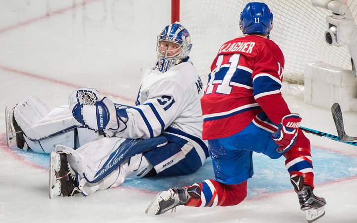 Toronto Maple Leafs goaltender Frederik Andersen looks back after being scored on by Montreal Canadiens' Alex Galchenyuk (not shown) as Canadiens' Brendan Gallagher looks for the rebound during second period NHL hockey action in Montreal, Saturday, November 19, 2016.
