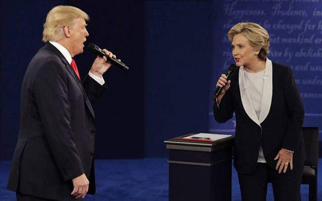 Republican presidential nominee Donald Trump and Democratic presidential nominee Hillary Clinton speak during the second presidential debate at Washington University in St. Louis.
