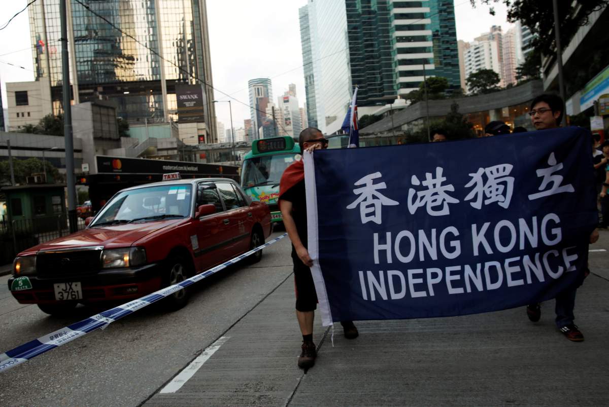 Demonstrators protest against what they call Beijing’s interference over local politics and the rule of law, a day before China’s parliament is expected to announce their interpretation of the Basic Law in light of two pro-independence lawmakers’ oath-taking controversy in Hong Kong, China November 6, 2016.