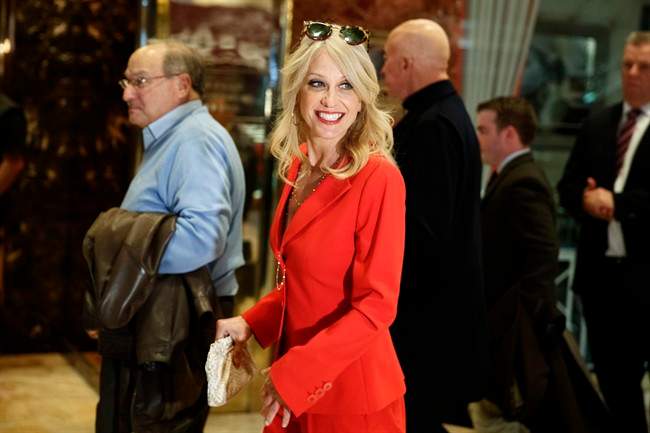Kellyanne Conway walks past reporters in the lobby of Trump Tower, Monday, Nov. 28, 2016, in New York.