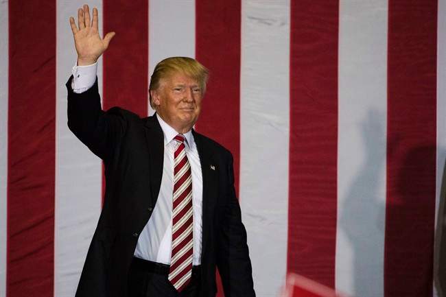 Republican presidential candidate Donald Trump waves during a campaign stop at the Jacksonville Equestrian Center in Jacksonville, Fla, Thursday, Nov. 3, 2016. (AP Photo/Matt Rourke).