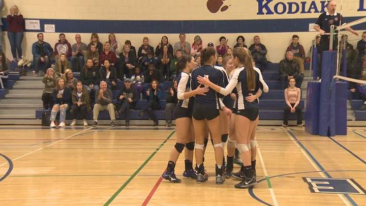The River East Kodiaks celebrate a point against the Westwood Warriors in a quarterfinal game during the MHSAA AAAA Girls' Volleyball Championship.