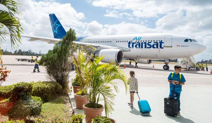 Passengers getting ready to board an airplane in Cuba