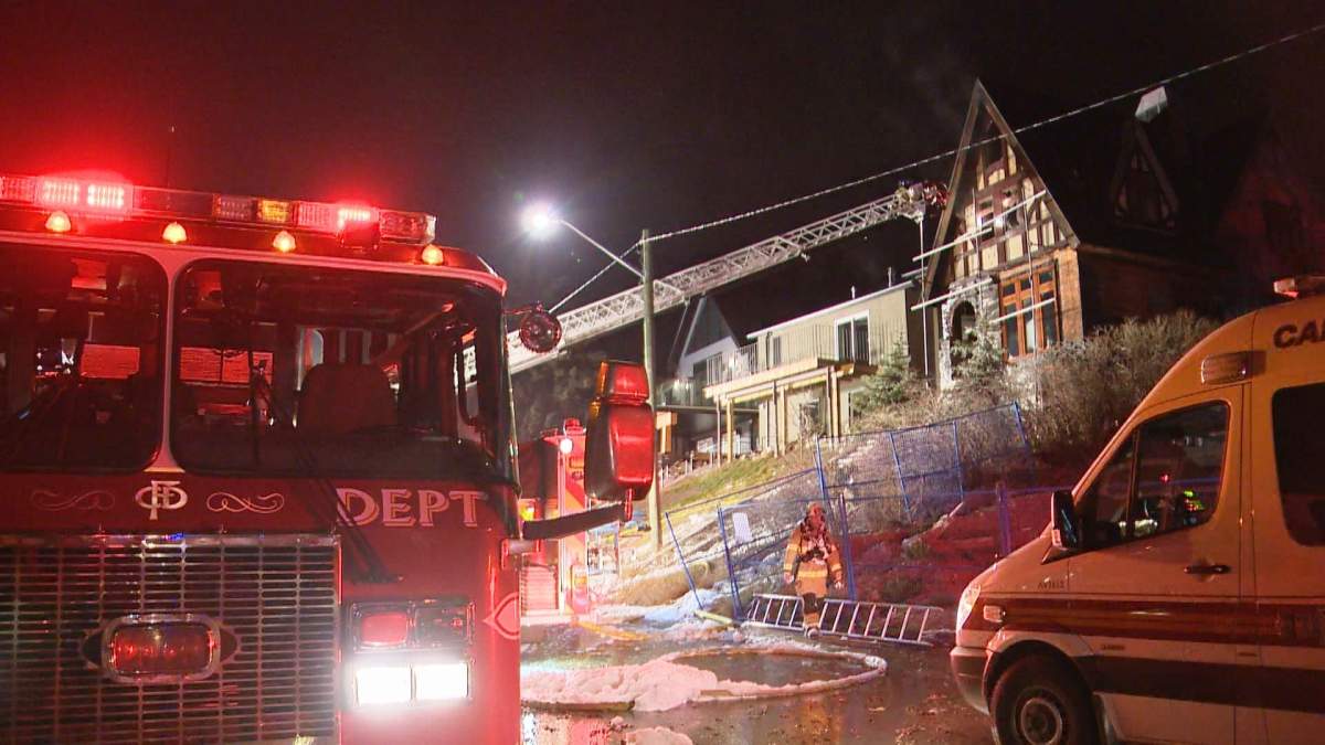Firefighters work to extinguish a fire in the 700 block of 13A Street N.E. on Tuesday, Nov. 22, 2016.