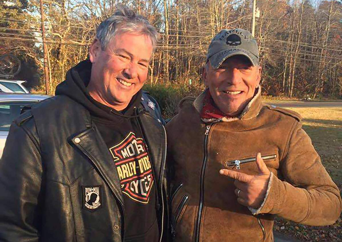 In this Friday, Nov. 11, 2016, photo provided by Ryan Bailey, Dan Barkalow, left, and Bruce Springsteen poses for a photo in Wall Township, N.J. Barkalow and a group from the Freehold American Legion was riding after a Veterans Day event Friday when they pulled over to help a stranded motorcyclist who turned out to be The Boss.