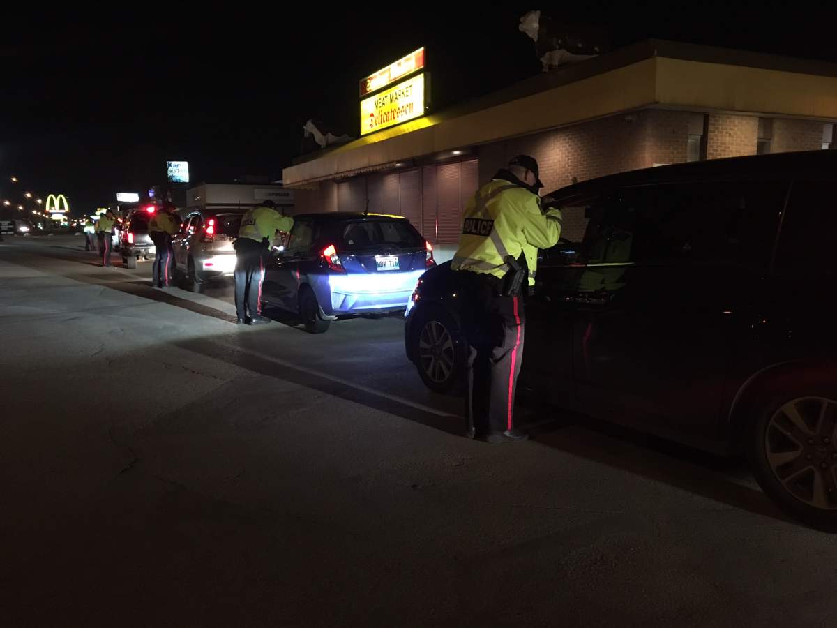 Winnipeg Police pulling cars over at their pre-festive check stop.