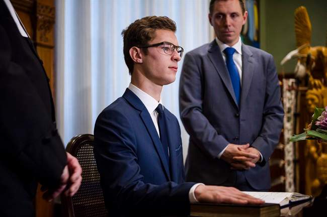 Nineteen-year-old Sam Oosterhoff is sworn in as the youngest-ever member of the Ontario legislature as Ontario PC Leader Patrick Brown, right, looks on in Toronto Wednesday, November 30, 2016. The Progressive Conservative was elected Nov. 17 in a byelection in Niagara West-Glanbrook, previously held by former party leader Tim Hudak. THE CANADIAN PRESS/Christopher Katsarov.