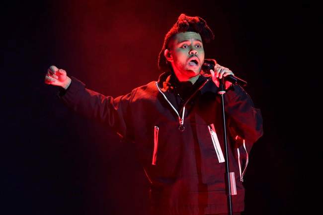 In this April 7, 2016, file photo, The Weeknd performs during the 2016 Echo Music Award ceremony in Berlin. The Canadian pop sensation is teaming up with the Swedish fast-fashion brand as he fronts their upcoming menswear collection \”Spring Icons Selected by The Weeknd.\”