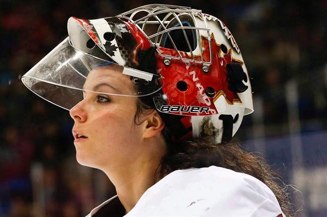 In this Feb. 17, 2014 file photo, goalkeeper Shannon Szabados of Canada skates off the ice after the second period of the 2014 Winter Olympics women's semifinal ice hockey game against Switzerland at Shayba Arena in Sochi, Russia.  