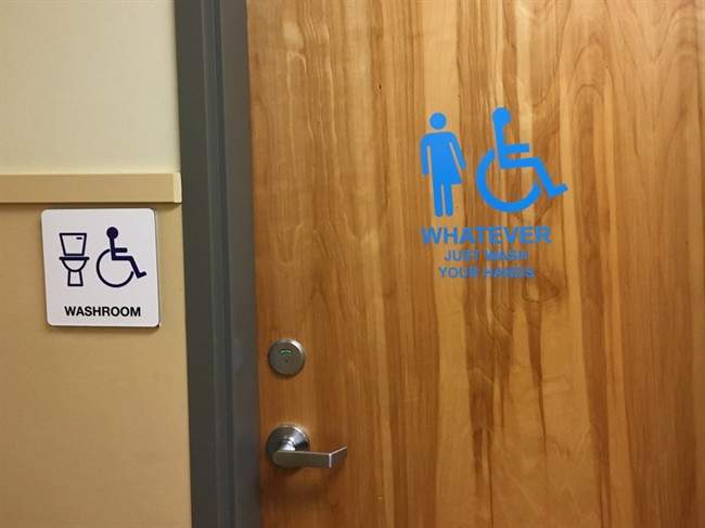 A bathroom door at Samuel Robertson Technical Secondary School in Maple Ridge, B.C., is shown in this recent handout photo.