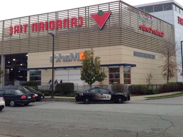 Police respond to a robbery at a Canadian Tire in East Vancouver on Nov. 10, 2016.