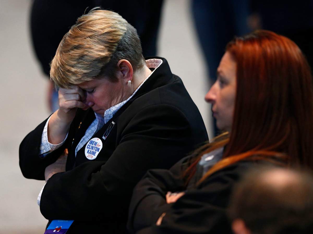 Hillary Clinton supporters react as results come in at an election night party for the Democratic presidential candidate at the Jacob K. Javits Convention Center in New York, late on Tuesday, Nov. 8, 2016.