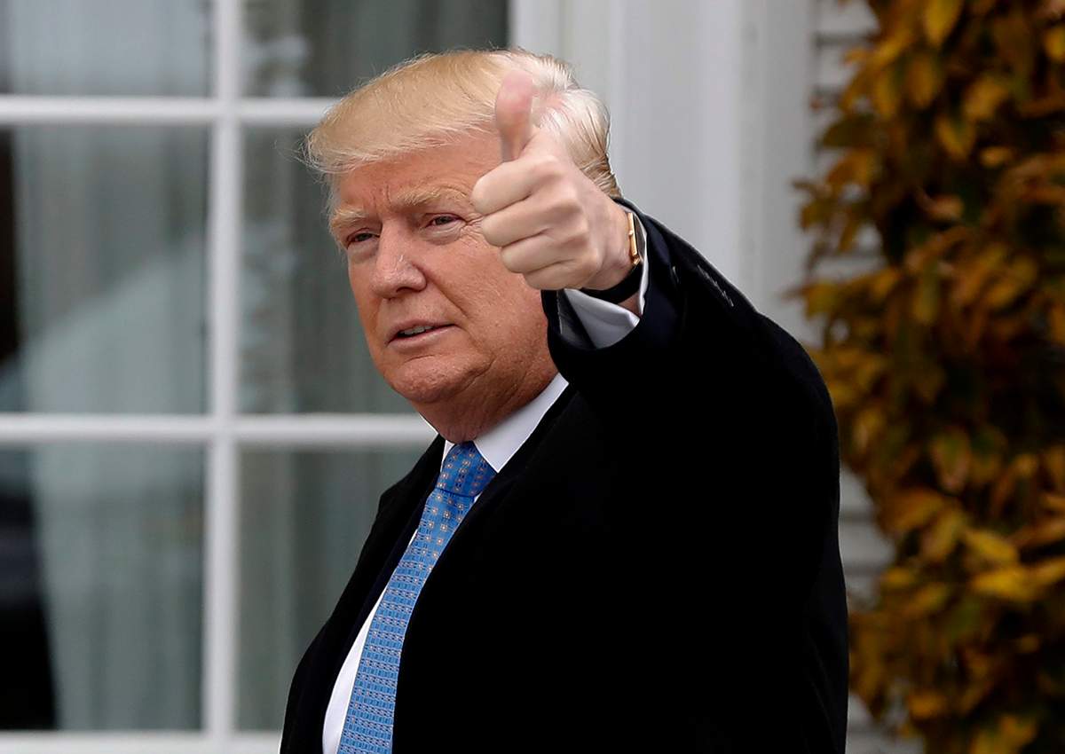 President-elect Donald Trump gives the thumbs up as he arrives at the Trump National Golf Club Bedminster clubhouse, Sunday, Nov. 20, 2016 in Bedminster, N.J.. 