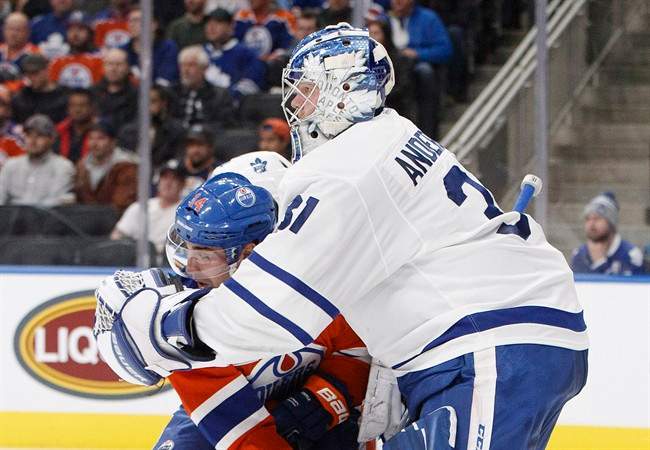 Toronto Maple Leafs' Frederik Andersen (31) holds to Edmonton Oilers' Jordan Eberle (14) during second period NHL action in Edmonton, Alta., on Tuesday November 29, 2016. 