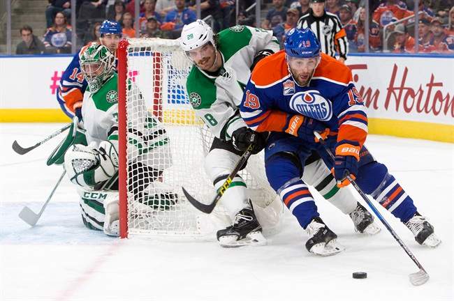 Dallas Stars' Stephen Johns (28) gives chase on Edmonton Oilers' Patrick Maroon (19) as goalie Kari Lehtonen (32) looks for the puck during second period NHL action in Edmonton, Alta., on Friday November 11, 2016. 