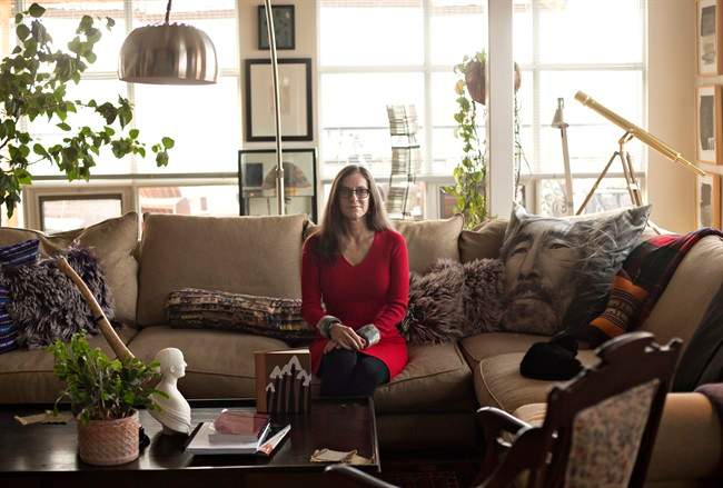 PhD Professor, Department of English Special Advisor to the University, Indigenous Initiatives Executive Director, Centre for the Advancement of Faculty Excellence MacEwan University, Valerie Henitiuk, is pictured at her home with variations of the book "Harpoon of the Hunter," in Edmonton, Alta., on Friday, November 11, 2016. An academic is dusting off a text considered the first Inuit novel in an effort to understand the travels and many translations of an almost-forgotten Canadian classic: "Harpoon of the Hunter.".