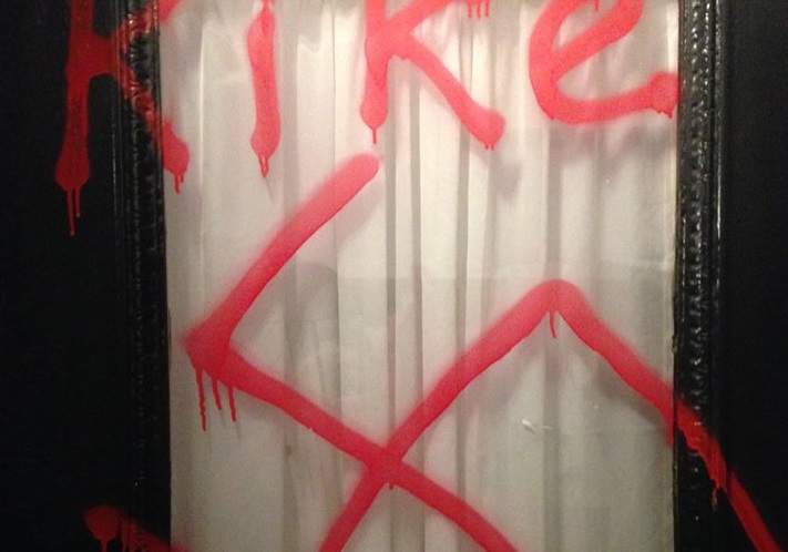 An Ottawa rabbi's front door is spraypainted with a swatika and racist slur.