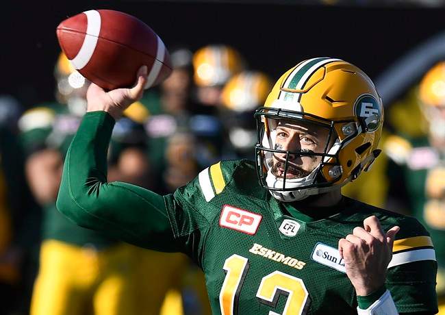 Edmonton Eskimos' Mike Reilly (13) throws for the pass during first half CFL playoff action against the Hamilton Tiger Cats, in Hamilton, Ont., on Sunday, November 13, 2016.