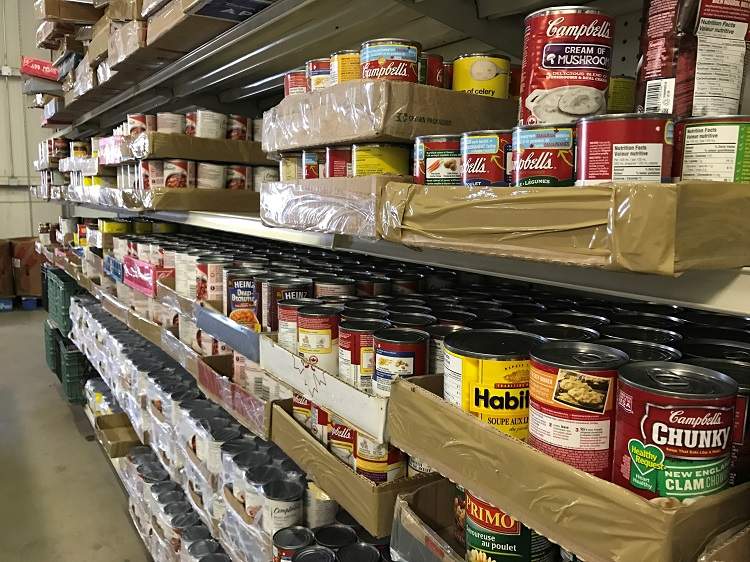 Cans on a shelf inside a Lethbridge food bank.