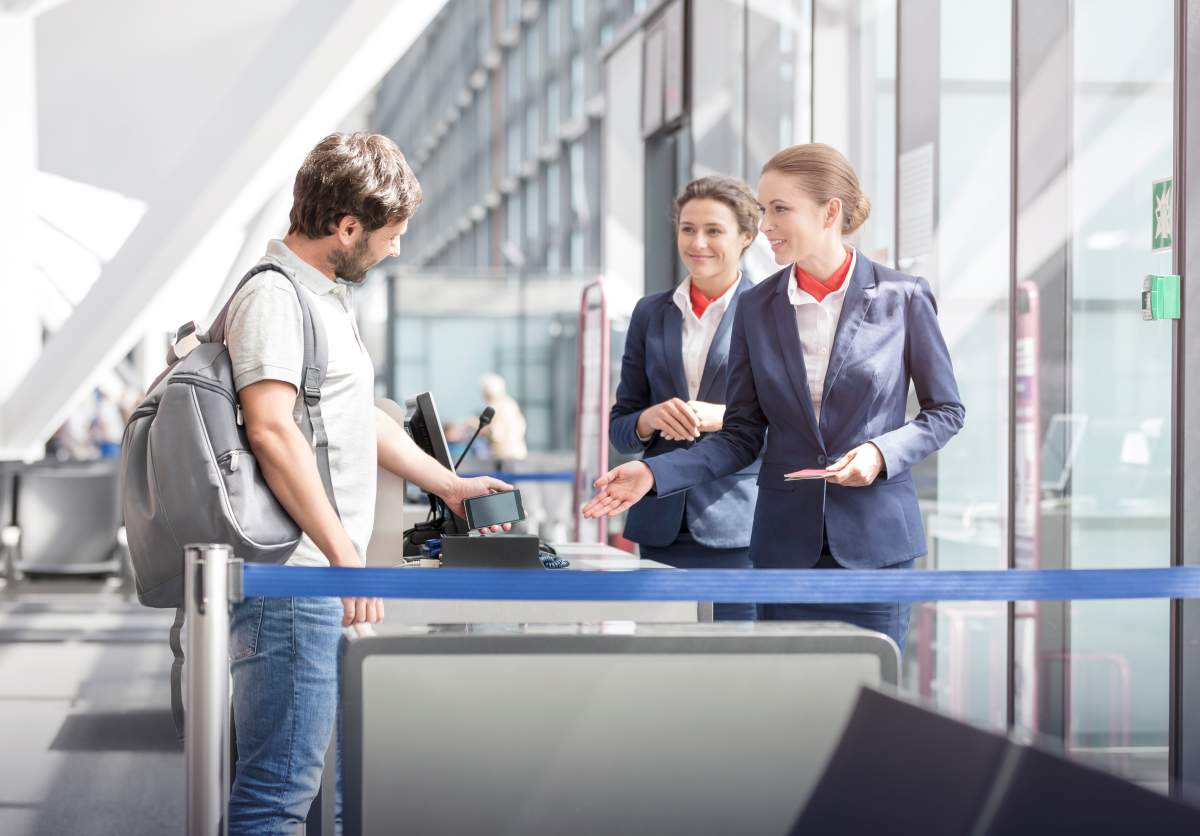 Tourist boarding at airport departure gate