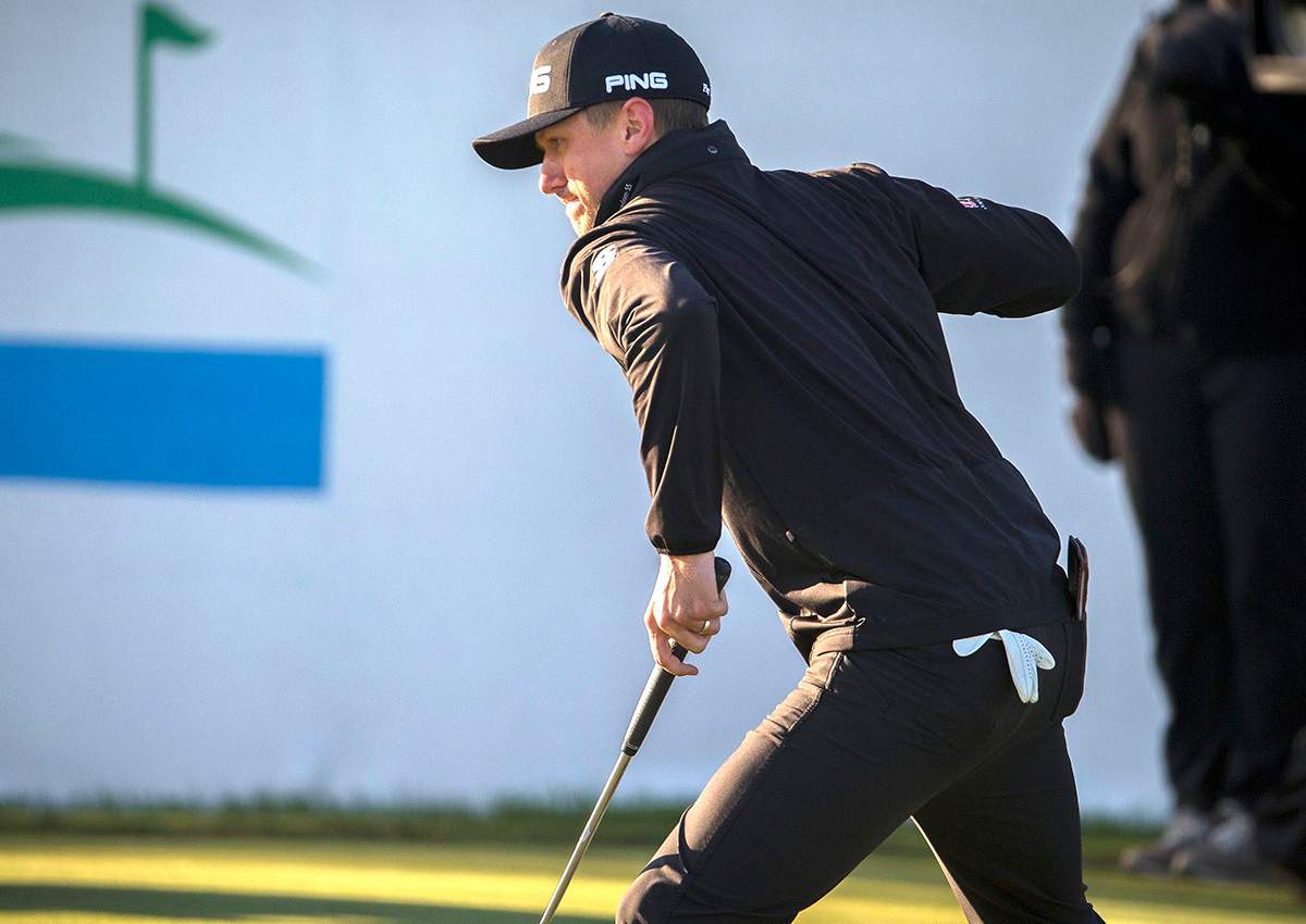Mackenzie Hughes, of Canada, pumps his fist after sinking a par putt on the 17th hole during the playoff round at the RSM Classic golf tournament, Monday, Nov. 21, 2016, in St. Simons Island, Ga.