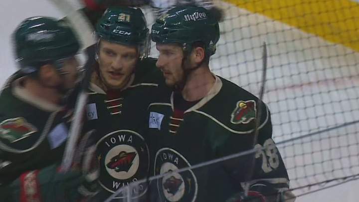 The Iowa Wild celebrate after scoring into the empty net in their 3-1 win over the Manitoba Moose on Wednesday.