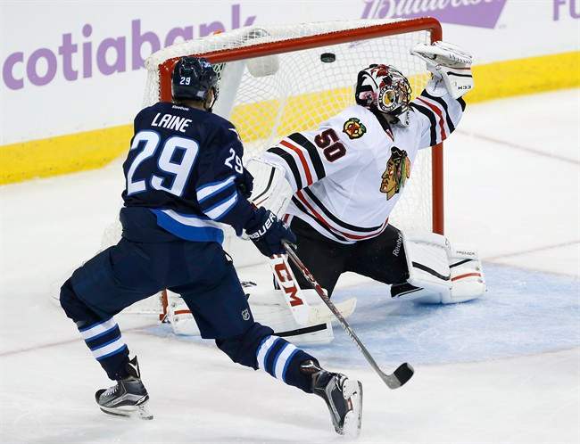 Winnipeg Jets' Patrik Laine scores on Chicago Blackhawks goaltender Corey Crawford during third period of a NHL game in Winnipeg on November 15, 2016.