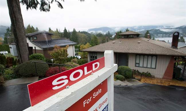 A sold sign is seen outside a home in North Vancouver, B.C. Thursday, Oct. 27, 2016. 