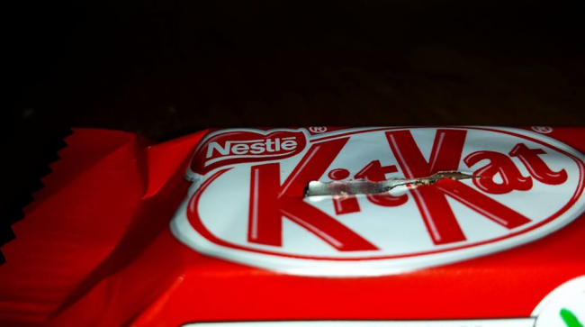 A sharp metal object is seen stuck inside this Kit Kat bar, found in a Halifax boy's bag of candy.
