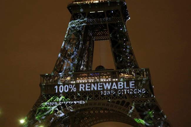 An artwork titled 'One Heart One Tree' is displayed on the Eiffel Tower ahead of the 2015 Paris Climate Conference in this Nov. 29, 2015 file photo.