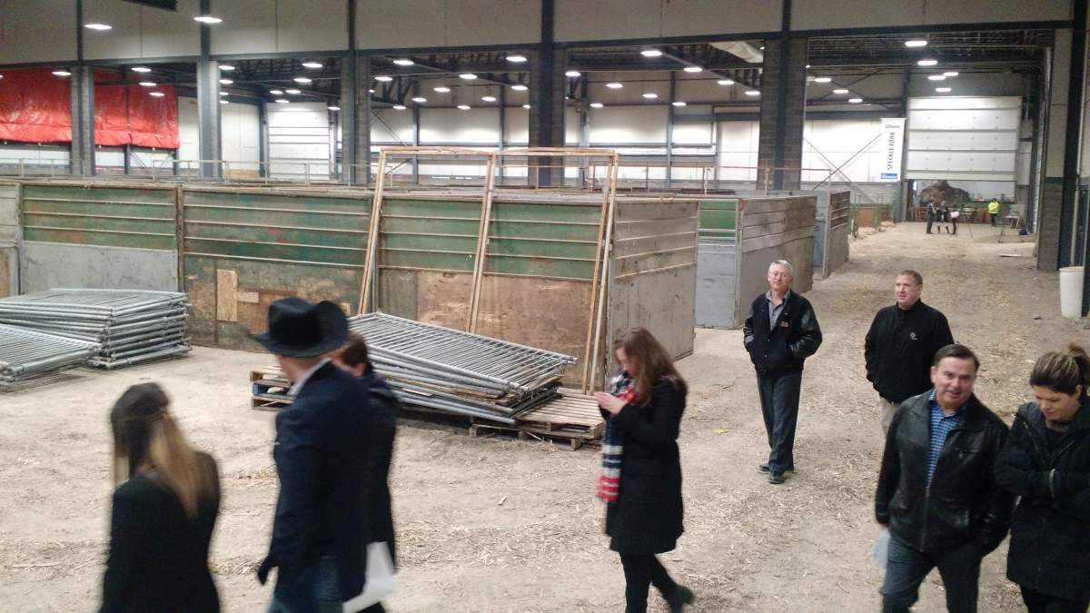 Agribition officials, media, and sponsors tour one of the finished exhibit halls at the International Trade Centre.