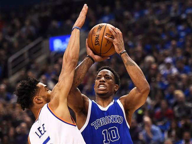 Toronto Raptors guard DeMar DeRozan (10) shoots past New York Knicks guard Courtney Lee (5) during first half NBA basketball action in Toronto on Saturday, November 12, 2016.