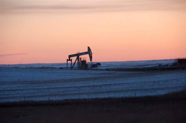 This Feb. 25, 2015, file photo, shows a pump jack for pulling oil from the ground, near New Town, N.D. On Tuesday, Nov. 8, 2016, the Energy Department said it is raising its forecast of U.S. production for both 2016 and 2017, as drillers respond to higher crude prices. Still, output won‚Äôt match 2015, which was the biggest year for U.S. production in 35 years. 