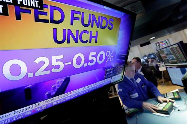 A television monitor on the floor of the New York Stock Exchange shows the decision of the Federal Reserve, Wednesday, Nov. 2, 2016. The Federal Reserve is leaving interest rates unchanged just days before Americans choose a new president, but hints again that it will likely raise rates at an upcoming meeting. 