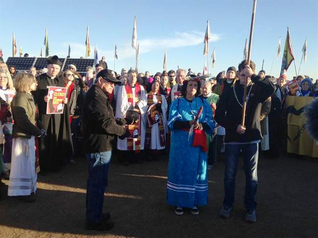 Members of the clergy join protesters against the Dakota Access oil pipeline in southern North Dakota near Cannon Ball on Thursday, Nov. 3, 2016, to draw attention to the concerns of the Standing Rock Sioux and push elected officials to call for a halt to construction. The tribe says the $3.8 billion, four-state pipeline threatens its drinking water and cultural sites.
