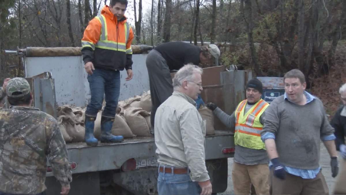 Volunteers haul sandbags to vulnerable properties near Port Alberni to keep water at bay as the Somass River rises on November 9, 2016. 
