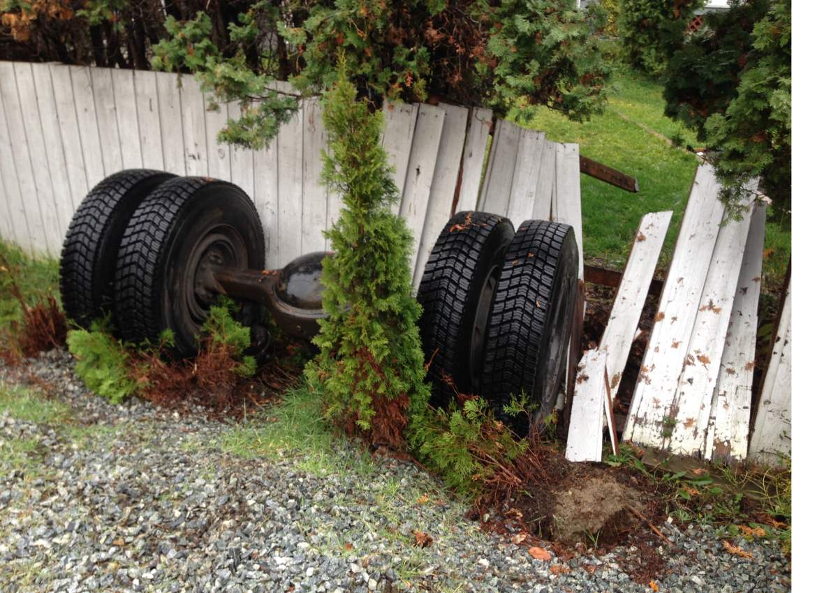 The back wheel of a school bus could be seen sitting on a fence after the accident on Tuesday.
