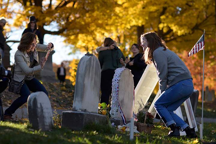 Kiernan Playford of Rochester poses for a photo at the grave of women’s suffrage leader Susan B. Anthony on U.S. Election Day at Mount Hope Cemetery in Rochester, New York November 8, 2016.
