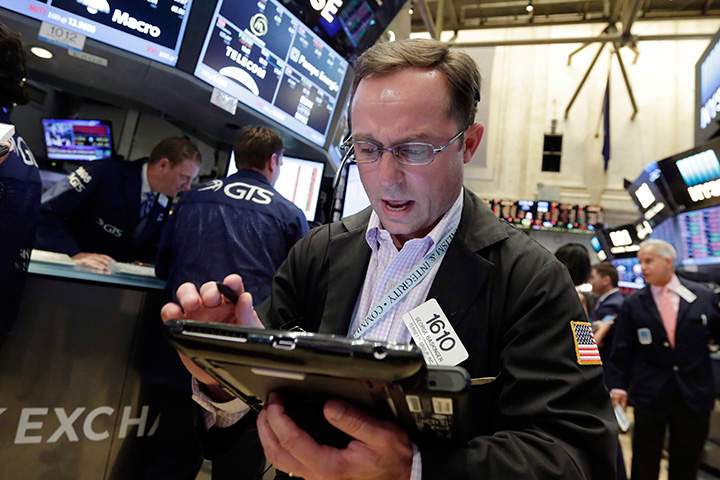 A trader works on the floor of the New York Stock Exchange in this Friday, June 24, 2016 file photo. 