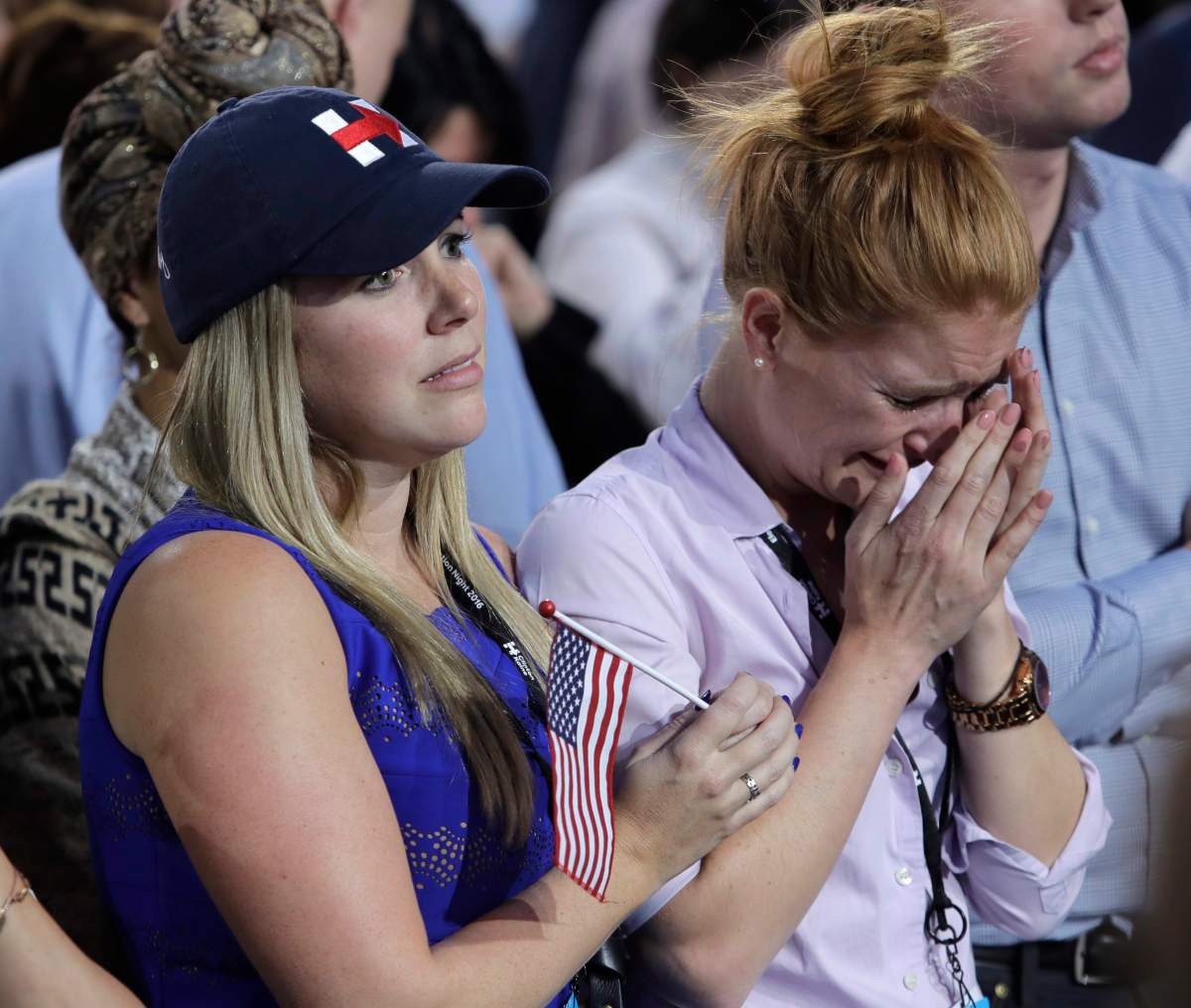 A woman weeps as election results are announced during Democratic presidential nominee Hillary Clinton’s election night rally in the Jacob Javits Center glass enclosed lobby in New York, Tuesday, Nov. 8, 2016.
