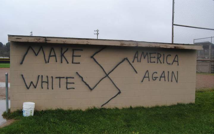 In New York State, the words “Make America White Again” was spray painted on a dugout at a baseball field in Wellsville. A large swastika was also painted on the dugout.
