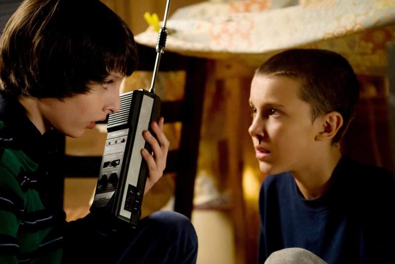 Finn Wolfhard, left, and Millie Bobby Brown, right, in Stranger Things Season 1, Episode 1.