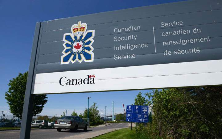 A sign for the Canadian Security Intelligence Service building is shown in Ottawa on May 14, 2013. Canada's spy agency is openly warning that Russia and China are out to steal the country's most prized secrets.
