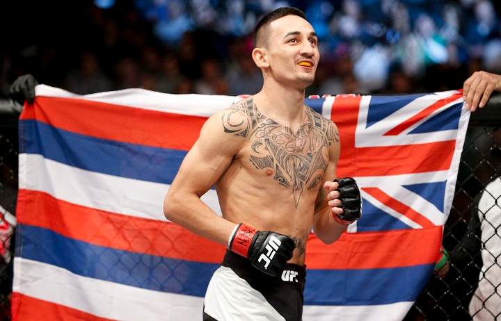 In this Dec. 12, 2015 file photo, Max Holloway warms up before fighting Jeremy Stephens in a featherweight mixed martial arts bout at UFC 194 in Las Vegas. The UFC took another step toward filling Conor McGregor's sizable featherweight shoes when Max Holloway took on Anthony Pettis in the main event of UFC 206 on Saturday night in Toronto. Dec. 10, 2016.