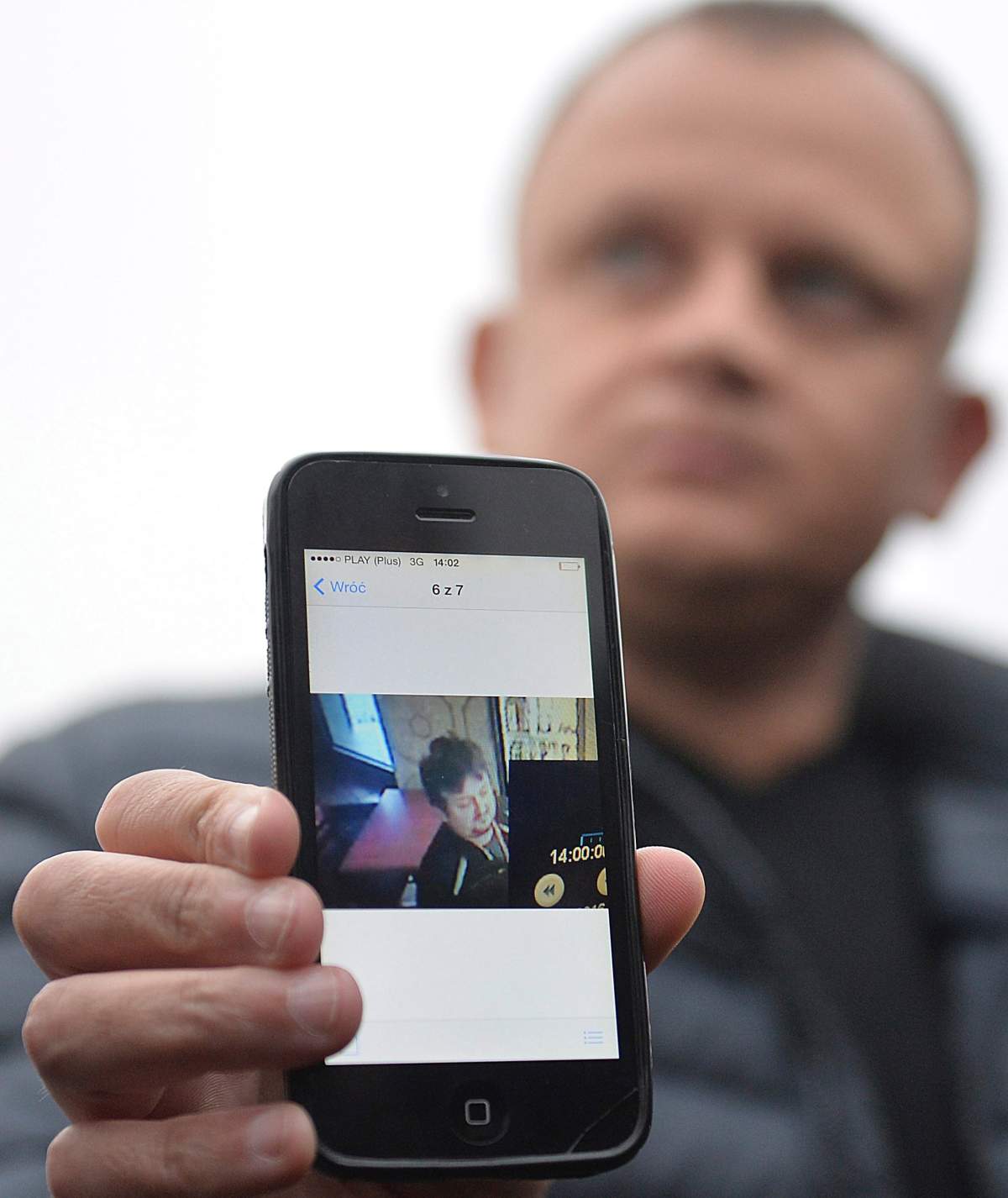 Ariel Zurawski, the owner of a Polish trucking company, shows the last photo taken of his cousin and driver, Lukasz Urban, who was apparently the first victim of the attack in Berlin on Monday, in Sobiemysl, Poland, on Tuesday, Dec. 20, 2016. The attacker apparently hijacked Urban’s truck and stabbed and shot the Poles to death before driving the truck into the Christmas market.