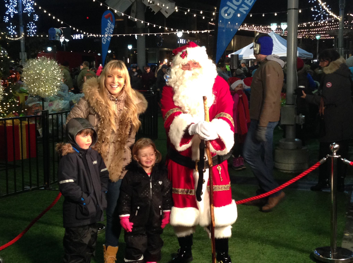 ET Canada’s Cheryl Hickey with Santa Claus at Toy Drive Live