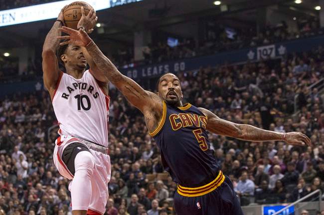 Cleveland Cavaliers guard J.R. Smith (right) tries to stop Toronto Raptors guard DeMar DeRozan drives to the basket during first half NBA basketball action in Toronto on Monday December 5, 2016. THE CANADIAN PRESS/Chris Young.